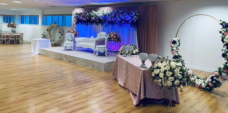 top table arrangment Eternity Hall Peter May Centre Wedding Walima Nikkah Mehndi Halal Catering event